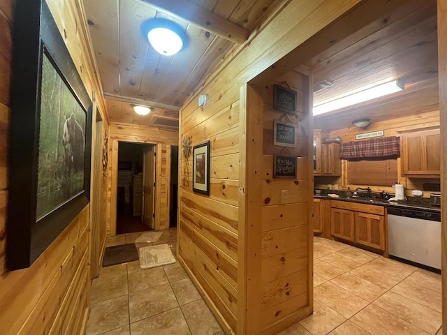 hallway featuring light tile patterned flooring, wooden ceiling, and wooden walls