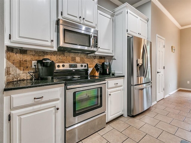 kitchen with white cabinetry, tasteful backsplash, ornamental molding, and appliances with stainless steel finishes