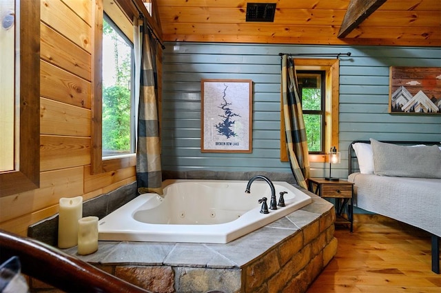 bathroom with wood-type flooring, wooden ceiling, and wooden walls