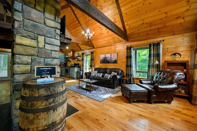 living room with light wood-type flooring, wooden walls, beam ceiling, high vaulted ceiling, and a notable chandelier