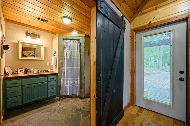 bathroom featuring vanity, wooden ceiling, vaulted ceiling, and wood-type flooring