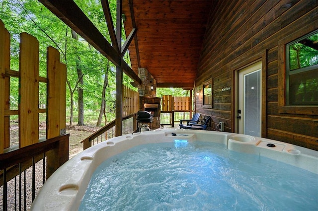 deck with a hot tub