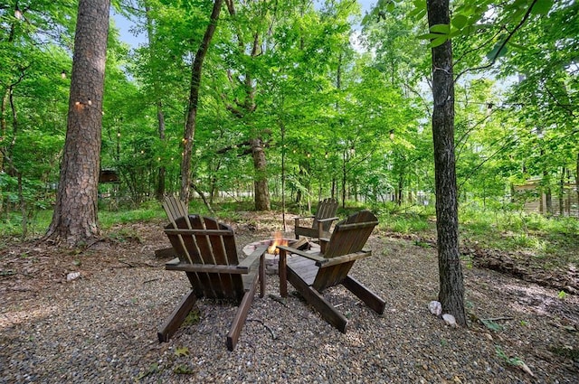 view of yard with an outdoor fire pit