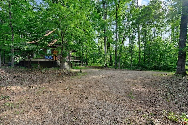 view of yard with a wooden deck