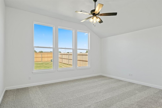 additional living space with carpet flooring, ceiling fan, and lofted ceiling