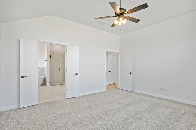 unfurnished bedroom featuring ensuite bathroom, vaulted ceiling, ceiling fan, and light colored carpet