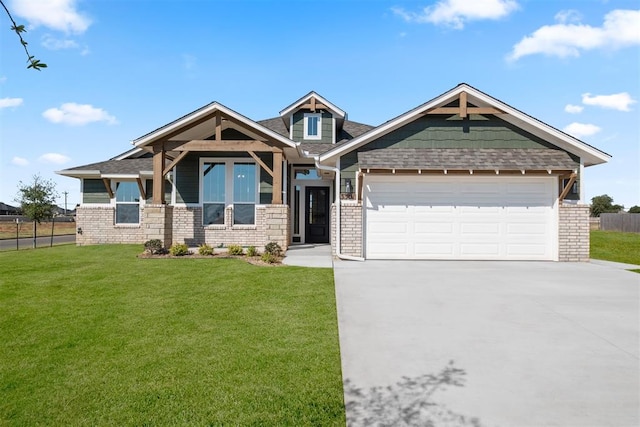 craftsman-style house featuring a front yard and a garage