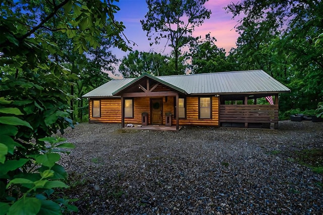 cabin featuring a porch