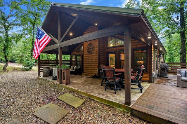 back of house featuring a wooden deck