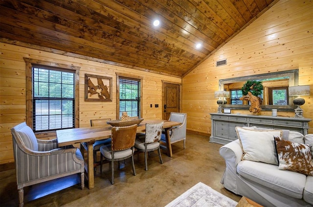 carpeted dining space featuring wood walls, wood ceiling, and vaulted ceiling