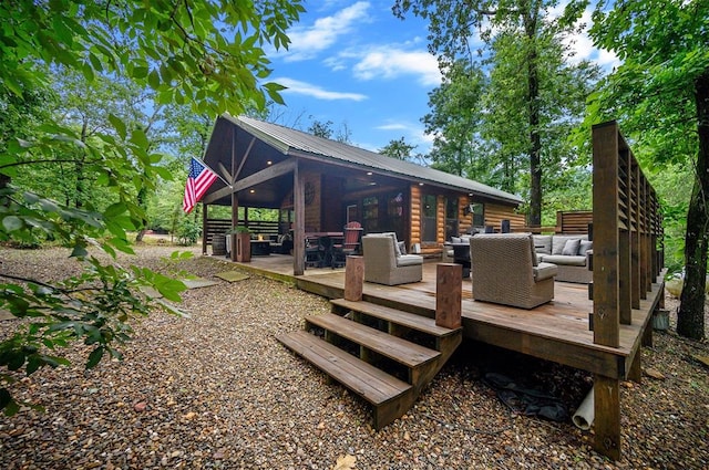 rear view of house with outdoor lounge area and a wooden deck