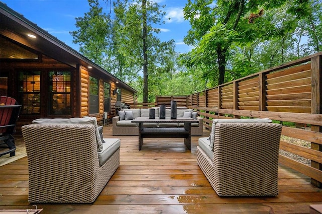 wooden deck featuring outdoor lounge area