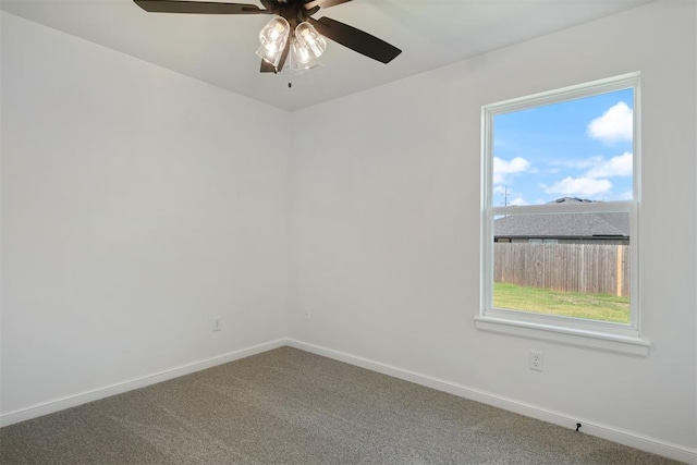 empty room featuring carpet and ceiling fan