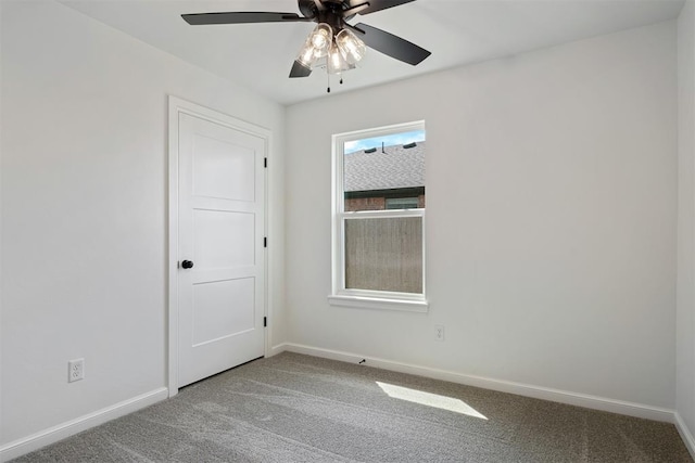 unfurnished room with carpet and ceiling fan