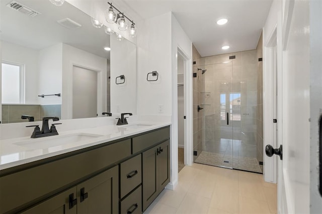 bathroom with vanity, tile patterned floors, and an enclosed shower