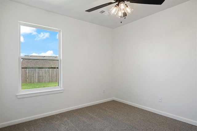 empty room featuring carpet floors and ceiling fan