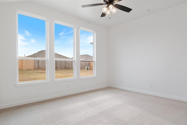 empty room with carpet flooring and ceiling fan