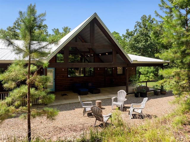 rear view of house featuring a patio