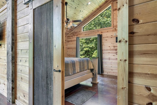 unfurnished bedroom with wood walls, wood ceiling, and lofted ceiling