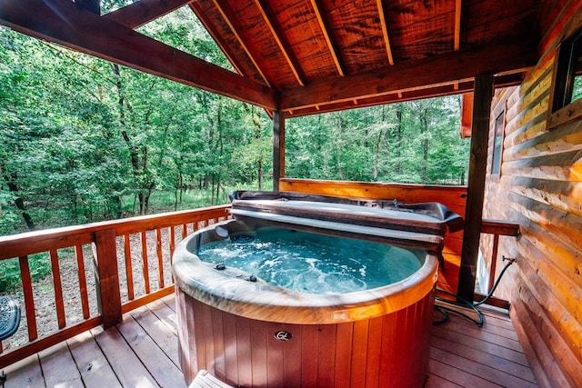 deck featuring a hot tub