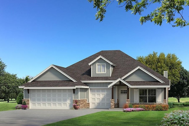 craftsman-style house featuring a garage and a front lawn