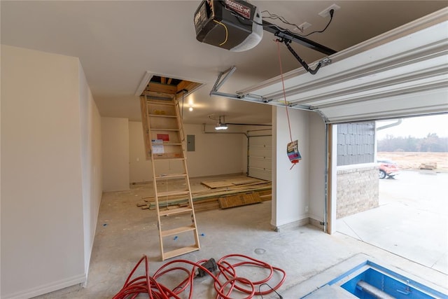 garage featuring electric panel and a garage door opener