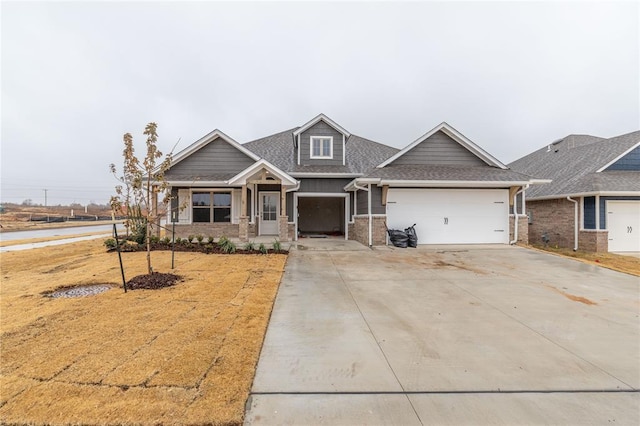 craftsman inspired home with a front yard and a garage