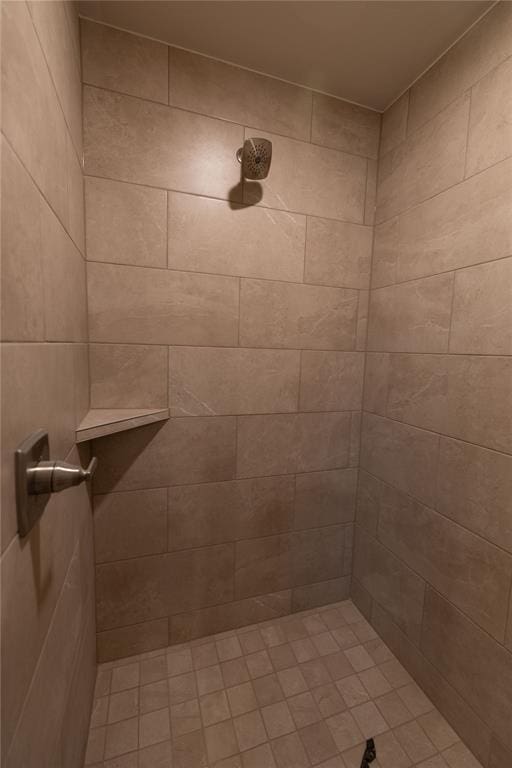 bathroom with a tile shower