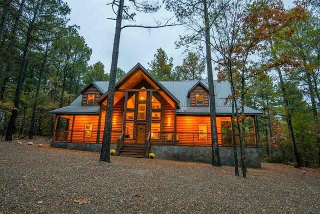 log cabin with covered porch