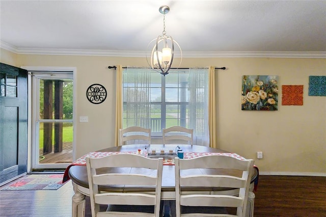 dining room featuring a chandelier, crown molding, and dark wood-type flooring