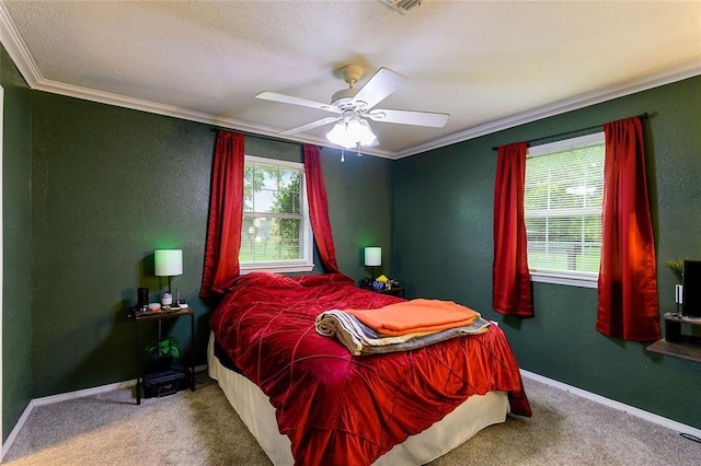 carpeted bedroom featuring a textured ceiling, ceiling fan, and crown molding