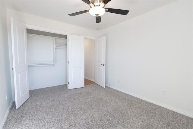 unfurnished bedroom with light carpet, ceiling fan, and a closet