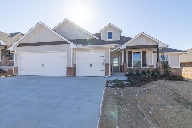 craftsman-style house featuring a garage and covered porch