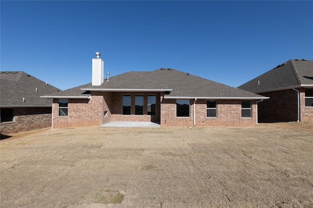 rear view of property featuring a patio