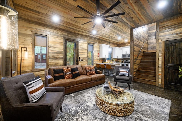 living room featuring ceiling fan, wooden walls, high vaulted ceiling, and wooden ceiling