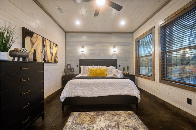 bedroom with wooden walls, ceiling fan, and wood ceiling