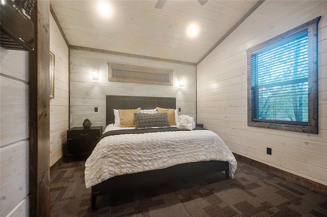 bedroom featuring ceiling fan, wood walls, lofted ceiling, and wood ceiling