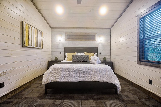 bedroom featuring wooden walls and vaulted ceiling