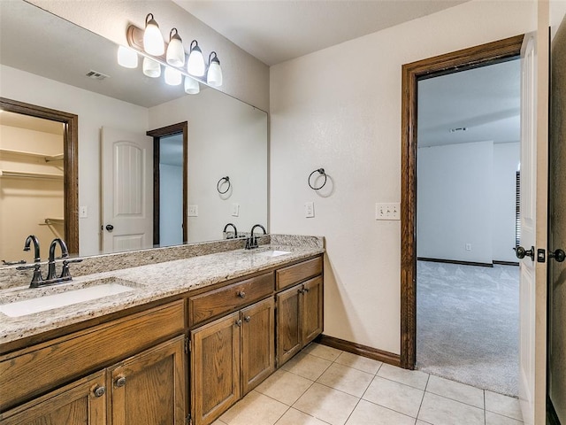 bathroom featuring tile patterned floors and vanity