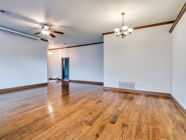 unfurnished room with crown molding, wood-type flooring, and ceiling fan with notable chandelier