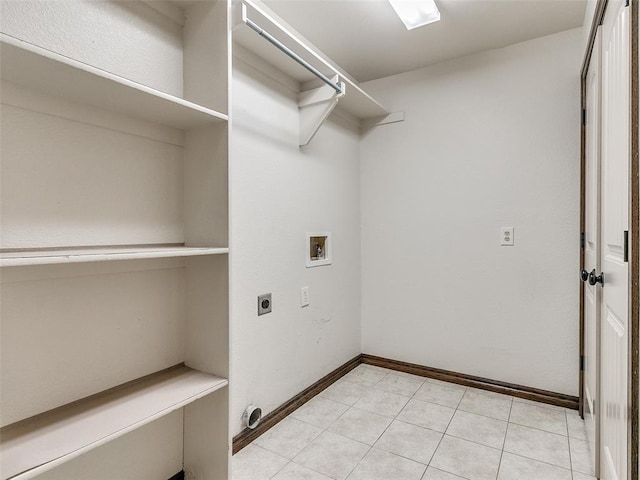 laundry area with washer hookup, light tile patterned floors, and electric dryer hookup