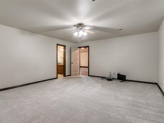 9500 S Brookline Ave, Oklahoma City, OK 73159 - spare room with light carpet, baseboards, ceiling fan, and visible vents