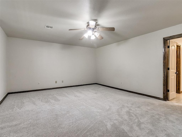 9500 S Brookline Ave, Oklahoma City, OK 73159 - unfurnished room with visible vents, a ceiling fan, baseboards, and light carpet