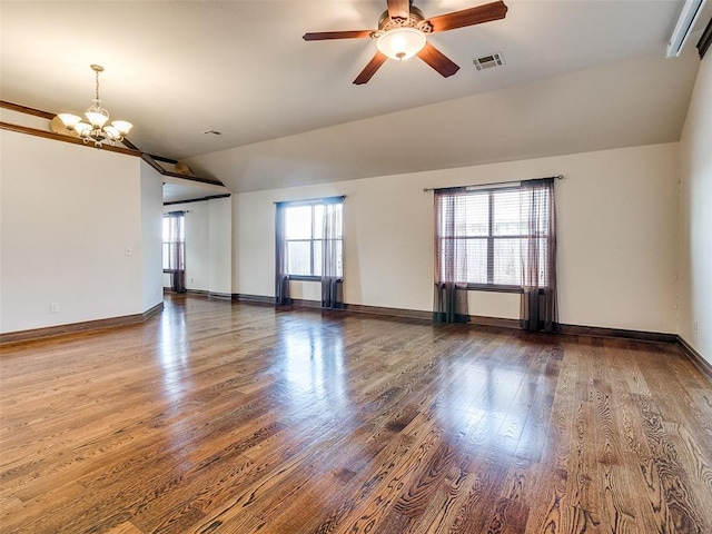 9500 S Brookline Ave, Oklahoma City, OK 73159 - unfurnished living room with wood finished floors, vaulted ceiling, visible vents, and ceiling fan with notable chandelier