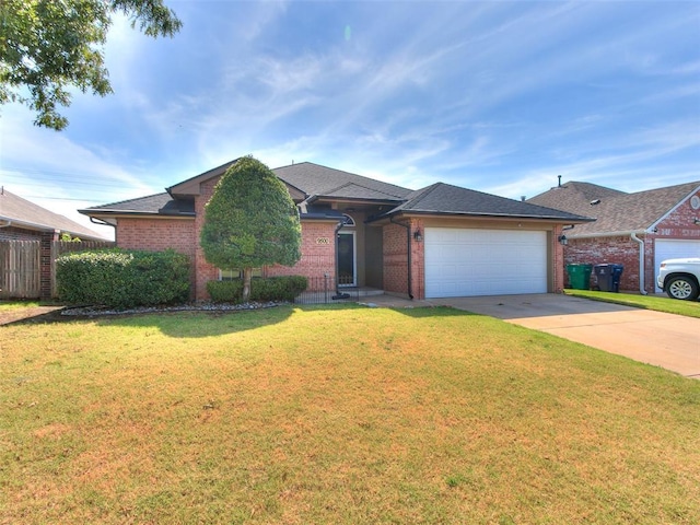 9500 S Brookline Ave, Oklahoma City, OK 73159 - ranch-style house featuring a front lawn, brick siding, driveway, and a garage