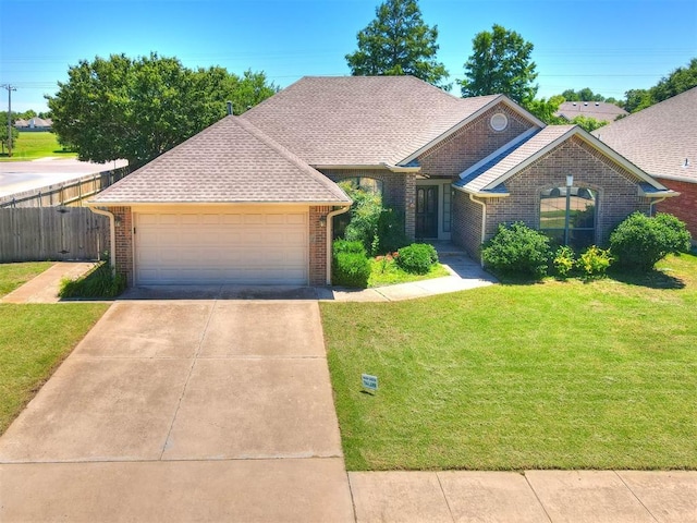 view of front facade with a garage and a front yard