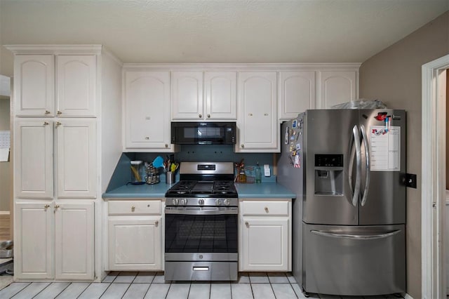 kitchen featuring white cabinets and stainless steel appliances