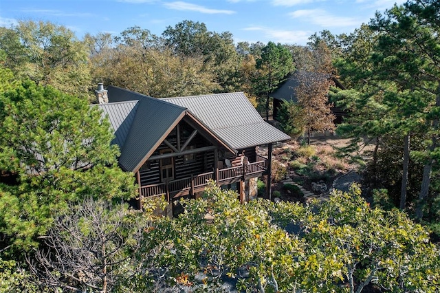 back of property with a wooden deck