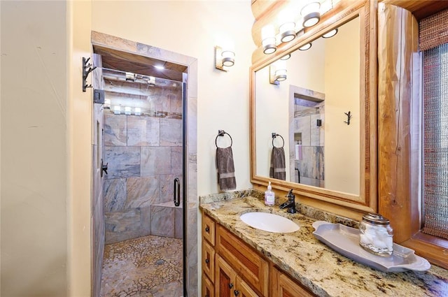 bathroom with vanity and an enclosed shower