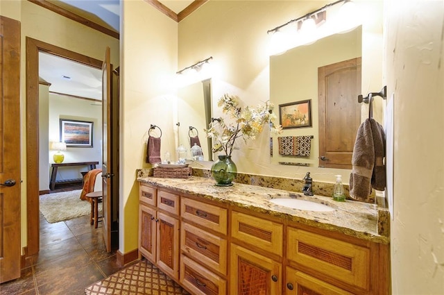 bathroom with tile patterned flooring, vanity, and ornamental molding